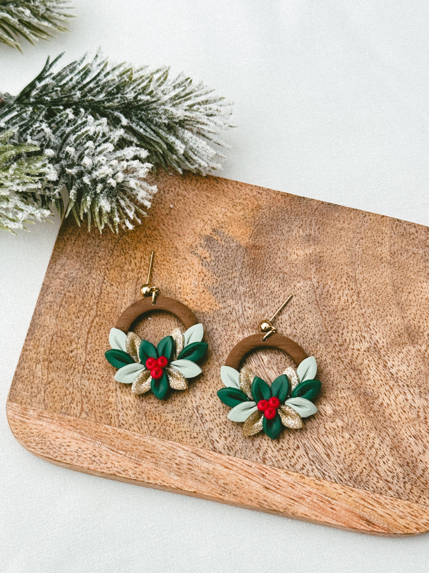 Christmas wreath with gold leaves and berries