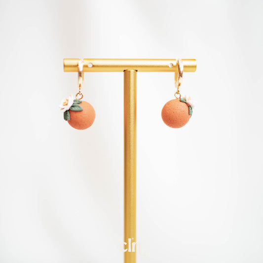 Orange huggie hoops - Earrings - CLN Atelier