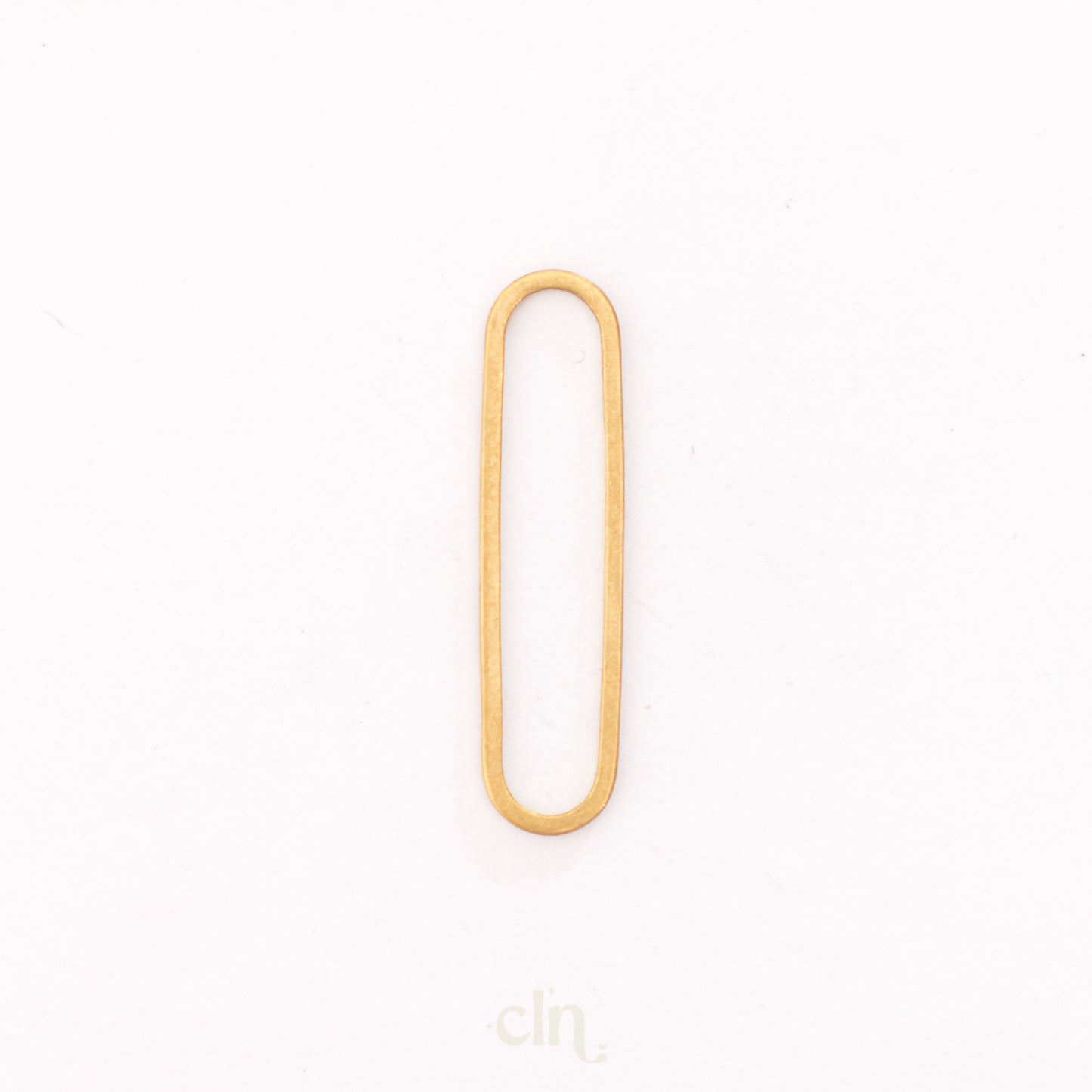 a gold colored metal object on a white background