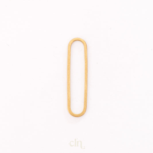 a gold colored metal object on a white background