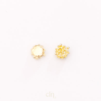 a pair of yellow diamond stud earrings